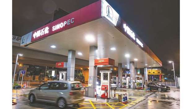 Vehicles refuel at a Sinopec gas station at night in Hong Kong. Sinopec, Asiau2019s largest refiner, is the most vulnerable to the higher freight costs as 70% to 80% of its  shipping costs are based on spot rates, Citiu2019s refining equity analysts said.