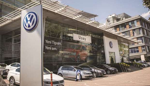 Vehicles for sale sit on display outside the Volkswagen automobile dealership in the Kasimpasa district of Istanbul (file). Volkswagen Turkey Otomotiv Sanayi ve Ticaret AS will design, manufacture and assemble motor vehicles, according to the notice.