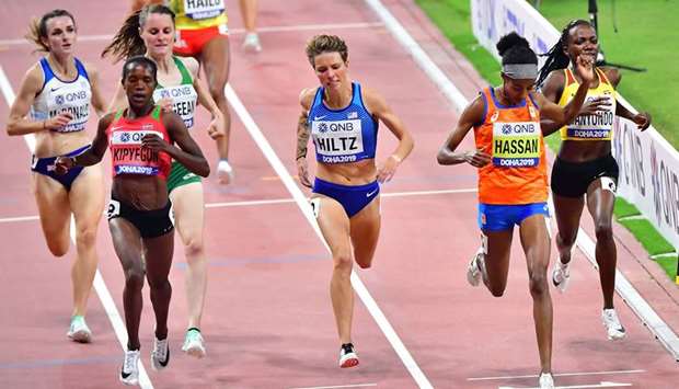Sifan Hassan (second from right) of the Netherlands crosses the finish line ahead of Kenyau2019s Faith Kipyegon (second from left) and Nikki Hiltz (centre) of the US to win the womenu2019s 1500m heats at the IAAF World Athletics Championships Doha 2019 at the Khalifa International Stadium in Doha yesterday. (AFP)