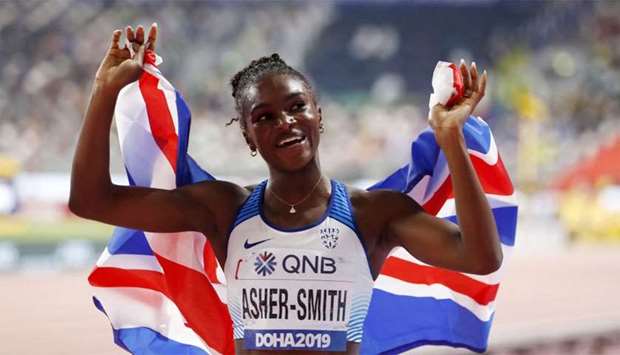 Britain's Dina Asher-Smith celebrates winning gold in Women's 200 Metres Final at Khalifa Internatio