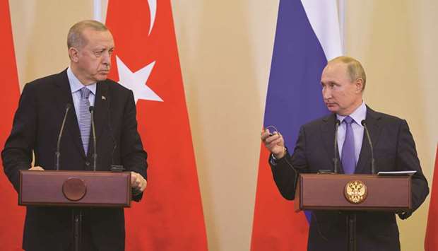 Russian President Vladimir Putin and Turkish President Tayyip Erdogan attend a news conference following their talks in Sochi, yesterday.