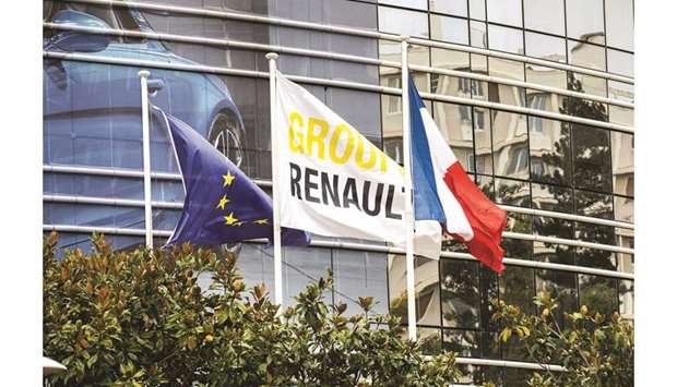 A Group Renault flag flies between an EU flag and a Franceu2019s national flag outside the Renault headquarters in the Boulogne Billancourt district of Paris. Franceu2019s INSEE official statistics agency said its index of industrial morale dropped to 99 points this month from 102 in September, hitting the lowest level since March 2015.