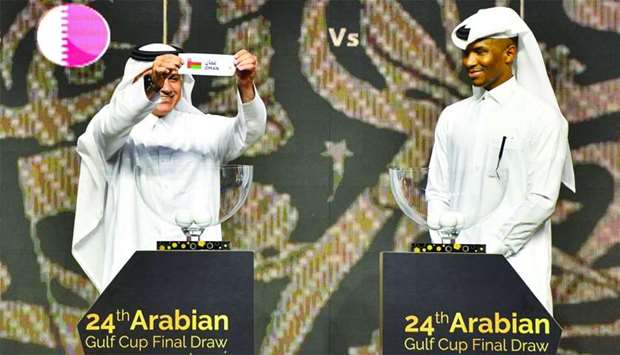 Former Qatari football captains Adel Malallah (L) and Belal Mohamed conduct the draw for the 24th Arabian Gulf Cup at the Marsa Malaz Kempinski, The Pearl u2013 Doha on Wednesday.