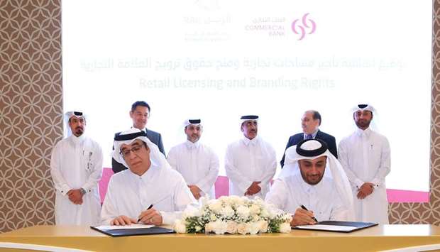 Commercial Bank's Khalifa Nasser al-Rayes and Qatar Rail's engineer Abdulla Saif al-Sulaiti sign agr