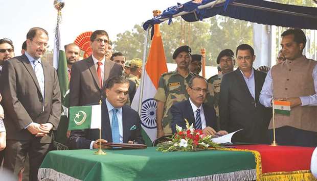 This handout picture released by the ministry of foreign affairs yesterday shows ministry spokesman Mohamed Faisal (centre-left) and Indian home ministry joint secretary SCL Das (centre-right) during an agreement signing ceremony on the visa-free India-Pakistan Kartarpur Corridor, in the town of Kartarpur, near the border.