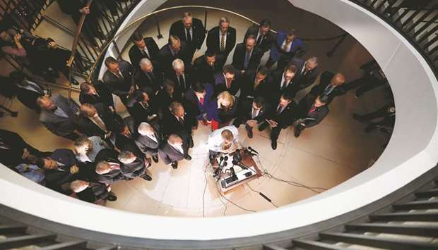 US House Republicans speak to reporters after Deputy Assistant Secretary of Defence Laura Cooper arrived to testify at a closed-door deposition, as part of the US House of Representatives impeachment inquiry into Trump.