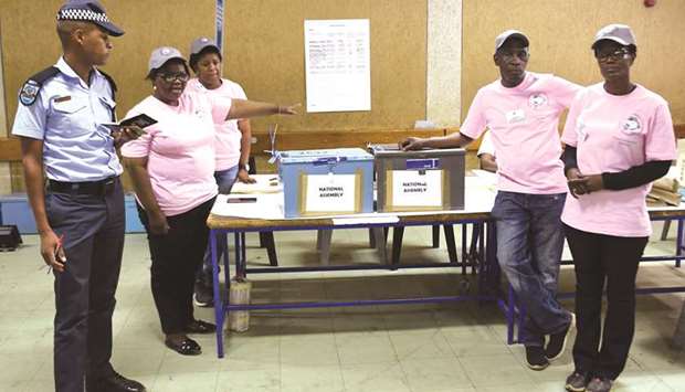 Polling officers verify ballots from ballot boxes arriving at a counting centre in the Ledumang Senior Secondary school for the Gaborone North constituency, in Gaborone.
