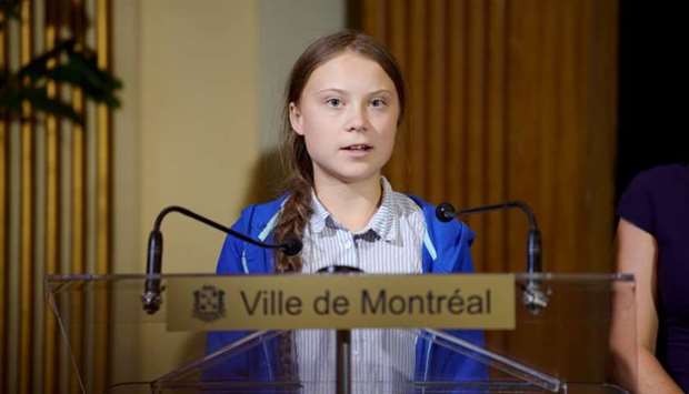 Climate change teen activist Greta Thunberg speaks as she receives the key to the city from Montreal Mayor Valerie Plante after a climate strike march in Montreal, Quebec, Canada on September 27