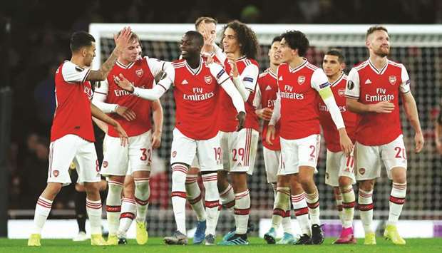 Arsenalu2019s Nicolas Pepe (third left) celebrates after scoring in the Europa League Group F match against Vitoria in the Emirates Stadium in London. (Reuters)