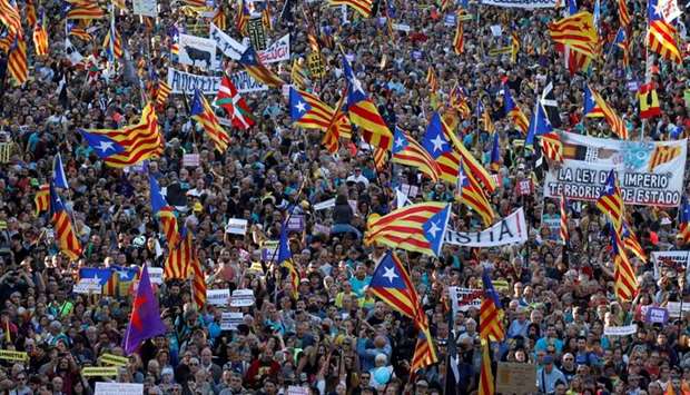 Catalan pro-independence demonstrators attend a protest to call for the release of jailed separatist leaders in Barcelona, Spain