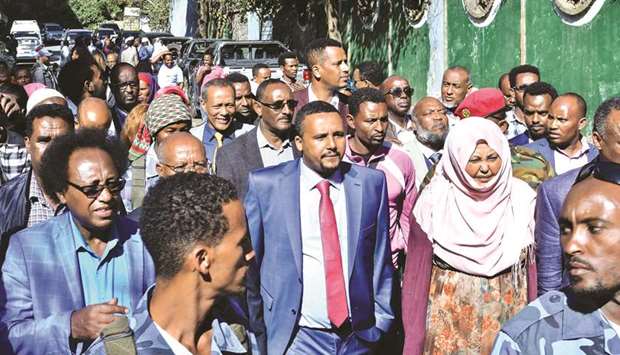 A photo taken on Thursday of Jawar Mohamed walking with his supporters outside his home in the Ethiopian capital Addis Ababa.