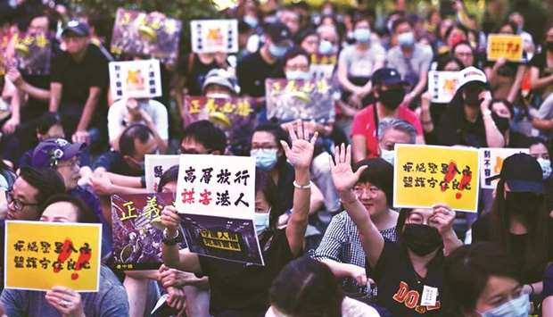 People take part in a rally of healthcare professionals in Hong Kongu2019s Central district yesterday.