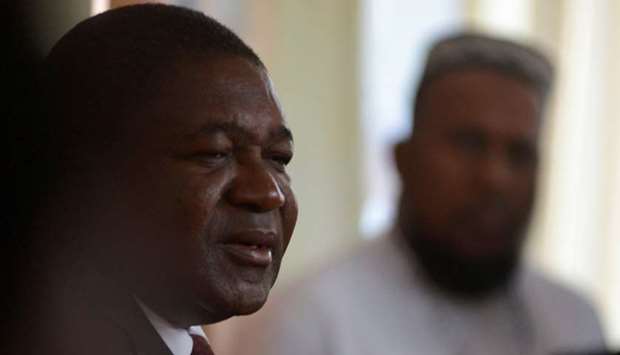 Mozambique's President Filipe Nyusi speaks with the press after voting in Maputo, Mozambique on October 15.