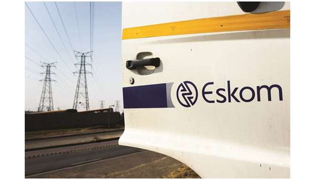 A company logo sits on an Eskom Holdings maintenance truck door in Soweto, South Africa (file). Bailouts for Eskom are draining the stateu2019s coffers and plans announced months ago to split it into three operating units and reorganize its $30bn mountain of debt remain a work in progress.