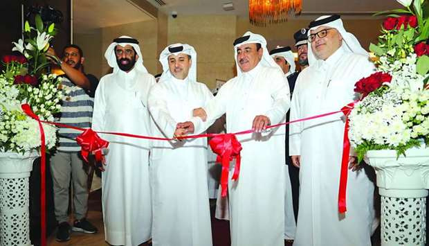 HE the Minister of Municipality and Environment Abdullah bin Abdulaziz bin Turki al-Subaie and HE the Minister of Transport and Communications Jassim Seif Ahmed al-Sulaiti open the exhibition at QSS as other dignitaries look on.