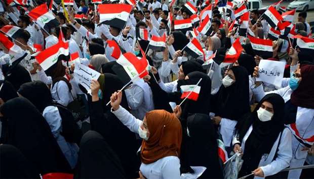 Iraqi medical students take part in an anti-government demonstration in the central city of Najaf