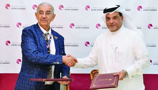 Qatar Chamber board member Mohamed bin Ahmed al-Obaidli and Asean Chamber of Commerce president Mohamed Izat Emir shaking hands after signing the MoU.