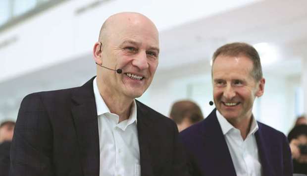 Frank Witter, chief financial officer (left), and Herbert Diess, CEO of Volkswagen react during the automakeru2019s annual news conference in Wolfsburg. In an internal newsletter sent last week, Witter prodded managers to get behind a goal to reach a valuation of u20ac200bn ($221bn), arguing that a higher stock price will help VW keep pace with rivals and strengthen its hand in negotiations with future partners.