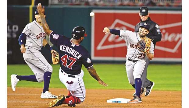 Houston Astros second baseman Jose Altuve (27) turns a double play over Washington Nationals first baseman Howie Kendrick (47) during the second inning in game five of the 2019 World Series at Nationals Park in Washington. PICTURE: Brad Mills-USA TODAY Sports