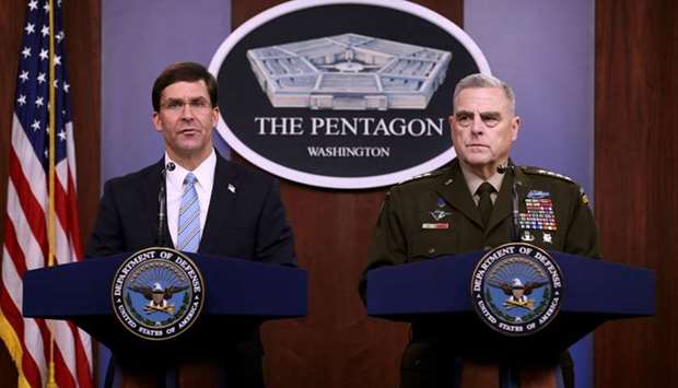 US Defense Secretary Mark Esper (L) and Chairman of the Joint Chiefs of Staff Gen. Mark Milley hold a news conference at the Pentagon the day after it was announced that Abu Bakr al-Baghdadi was killed in a US raid in Syria