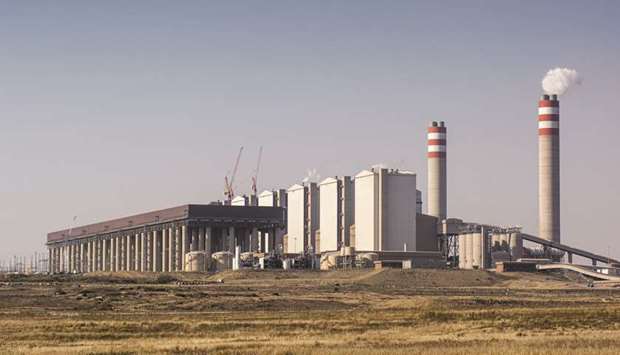 Emissions rise from Eskom Holdings coal-fired power station near Witbank in Mpumalang. South Africa unveiled a long-awaited plan to save its debt-stricken power utility, including exposing it to greater competition, lowering fuel costs, increasing renewable-energy output and selling non-core assets.