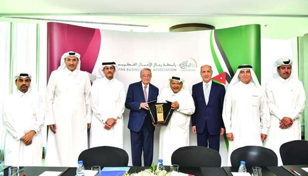 QBA chairman Sheikh Faisal bin Qassim al-Thani and JBA chairman Hamdi al-Tabau2019a exchanging tokens of recognition during the Qatar-Jordan Joint Business Council held in Doha.