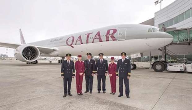 Qatar Airways cockpit and cabin crew with the airlineu2019s 50th Boeing 777. File picture: May 9, 2016