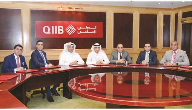QIIB deputy CEO Jamal al-Jamal and other senior executives attending the workshop.