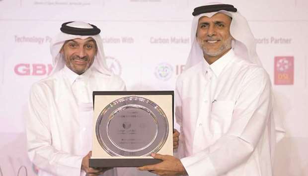 Hani Ballan (L), Board Member of the QFA and CEO of QSL, receiving the honorary shield from Dr Yousef bin Mohamed al-Hor, Chairman of the Gulf Organisation for Research and Development (GORD).