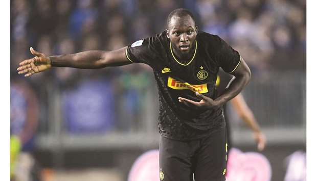 Inter Milanu2019s Romelu Lukaku bows as he celebrates scoring their second goal on Tuesday night.