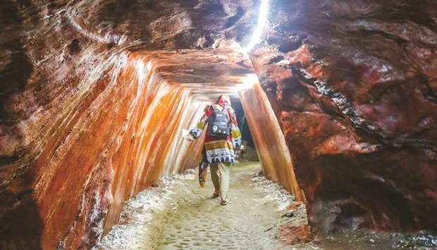 JOURNEY: A tourist walks around a salt cave inside the Khewra Salt Mines.