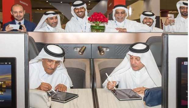HE Sheikh Abdulla bin Mohamed bin Saud al-Thani and HE Akbar al-Baker signing the agreement.