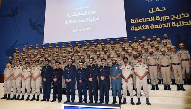 Cadets with Major General Dr Abdullah Yousef al-Mal, advisor to the Minister of Interior and Deputy Chairman of the Supreme Council of Police College and Brigadier General Dr Mohamed Abdullah al-Marri, Director General of Police and other MoI officials