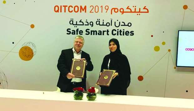 MoTC's engineer Nora Yousef al-Abdulla and TUViT's Frank Beuting at the signing ceremony