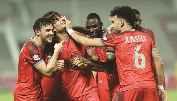 Al Duhailu2019s Mohanad Ali (second left) celebrates with teammates after scoring against Al Sailiya during their QNB Stars League match yesterday.