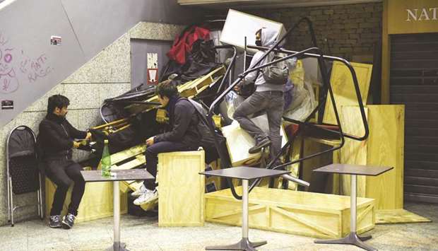 This picture taken late on Saturday shows climate protesters inside the Italie Deux shopping mall in Paris, during a demonstration called by the Extinction Rebellion environmental activist movement.