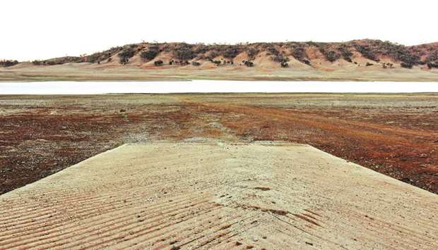 A boat ramp leads to the drought-affected Split Rock Dam near Tamworth in rural Australia: parts of northern and inland New South Wales, along with southern Queensland, have been in drought since 2016, severely depleting river and dam levels.