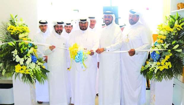 Qatar Post officials at the launch of the new Madinat Khalifa branch.rnrn