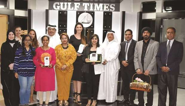 GROUP PHOTO: Faisal Abdulhameed al-Mudahka, Editor-in-Chief of Gulf Times, and Ebrahim Akber al-Ashar, Chairman of IMB Qatar, with the winner and runners-up of the competition.