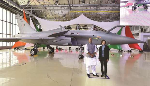 Defence Minister Rajnath Singh poses next to his French counterpart Florence Parly during the ceremony marking the delivery of the first of 36 Rafale fighter jets destined for India, at Dassault Aviation plant in Merignac yesterday.