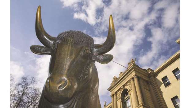 A statue of a bull is seen outside the Frankfurt Stock Exchange. The DAX 30 gained 1.0% to close at 12,094.26 points yesterday.