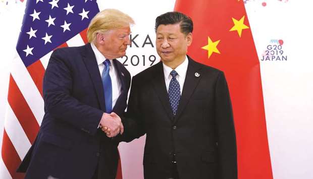 US President Donald Trump and Chinau2019s President Xi Jinping shaking hands ahead of their bilateral meeting during the G20 leaders summit in Osaka, Japan, on June 29, 2019.