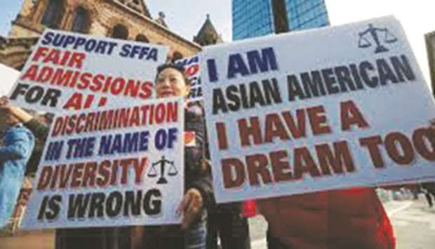 Supporters attend the u201cRally for American Dream u2013 Equal Education Rights for Allu201d, ahead of the start of a trial in a lawsuit accusing Harvard University of discriminating against Asian-American applicants, in Boston on October 14, 2018.