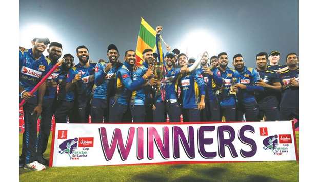 Sri Lankan players celebrate with the trophy after winning the three-match T20 series against Pakistan in Lahore. (AFP)