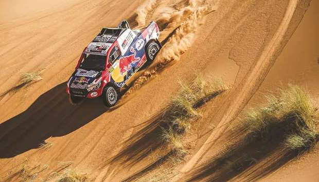Nasser Saleh al-Attiyah (also inset) in action in the Rally of Morocco, the final round of the FIA World Cup for Cross-Country Rallies, which concluded yesterday.