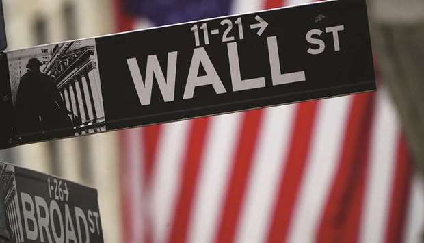 A Wall Street sign is pictured outside the New York Stock Exchange in the Manhattan borough of New York City on October 2. From a Democratic sweep to the unwinding of Septemberu2019s correction to a belief that a stimulus package is inevitable, a bundle of divergent explanations exist for what just spurred the stock marketu2019s biggest weekly rally in three months.