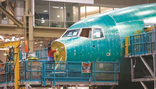 An employee works on the nose of a Boeing airplane at the companyu2019s facility in Everett, Washington (file). As recently as last year, Boeing was making record numbers of 787s at its Everett widebody hub north of Seattle and u2013 since 2012 u2013 a second plant in North Charleston, South Carolina.