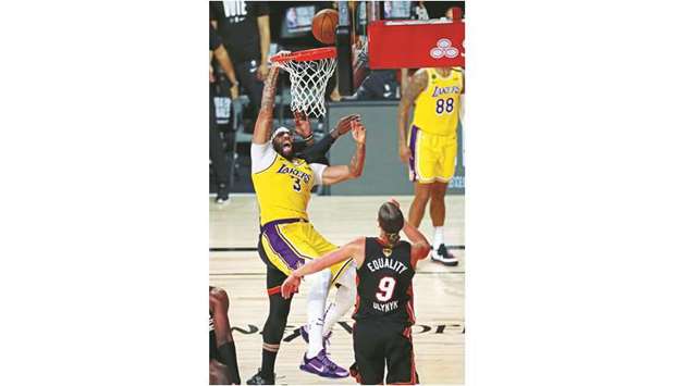 Los Angeles Lakersu2019 Anthony Davis (left) is fouled during Game One of the 2020 NBA Finals against Miami Heat at AdventHealth Arena in Lake Buena Vista, Florida, United States, on Wednesday. (USA TODAY Sports)