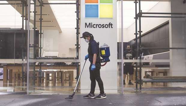 A cleaner vacuuming outside a Microsoft store in New York. By dramatically dismantling Trickbotu2019s network, Microsoft and its partners believe they will likely head-off ransomware attacks that could compromise voting systems before the US presidential election on November 3.