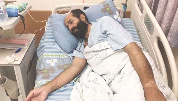 Maher al-Akhras, 49, a Palestinian who began a hunger strike 79 days ago against his detention without charge, lies in a hospital bed in Rehovot, yesterday.